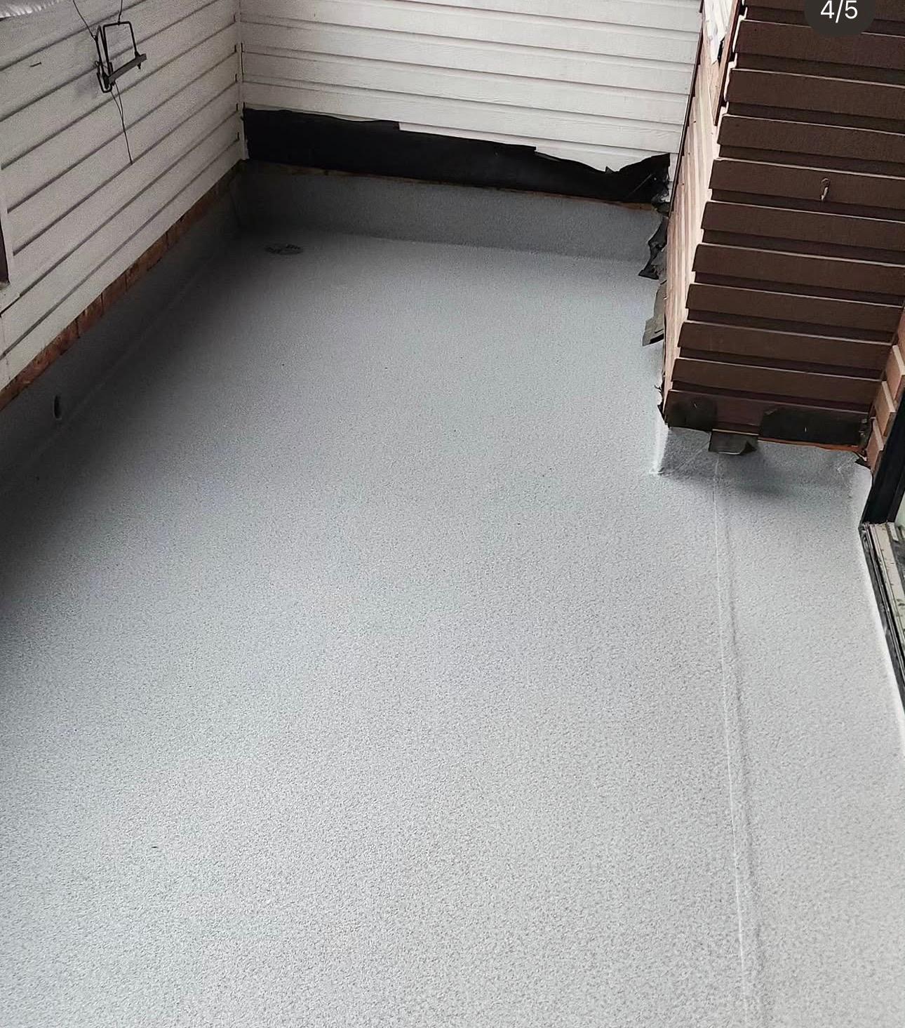 Vinyl-clad balcony floor between two homes