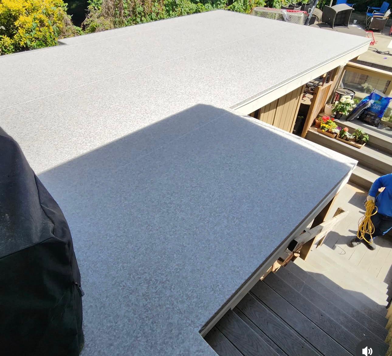Two-level vinyl deck overlooking a patio